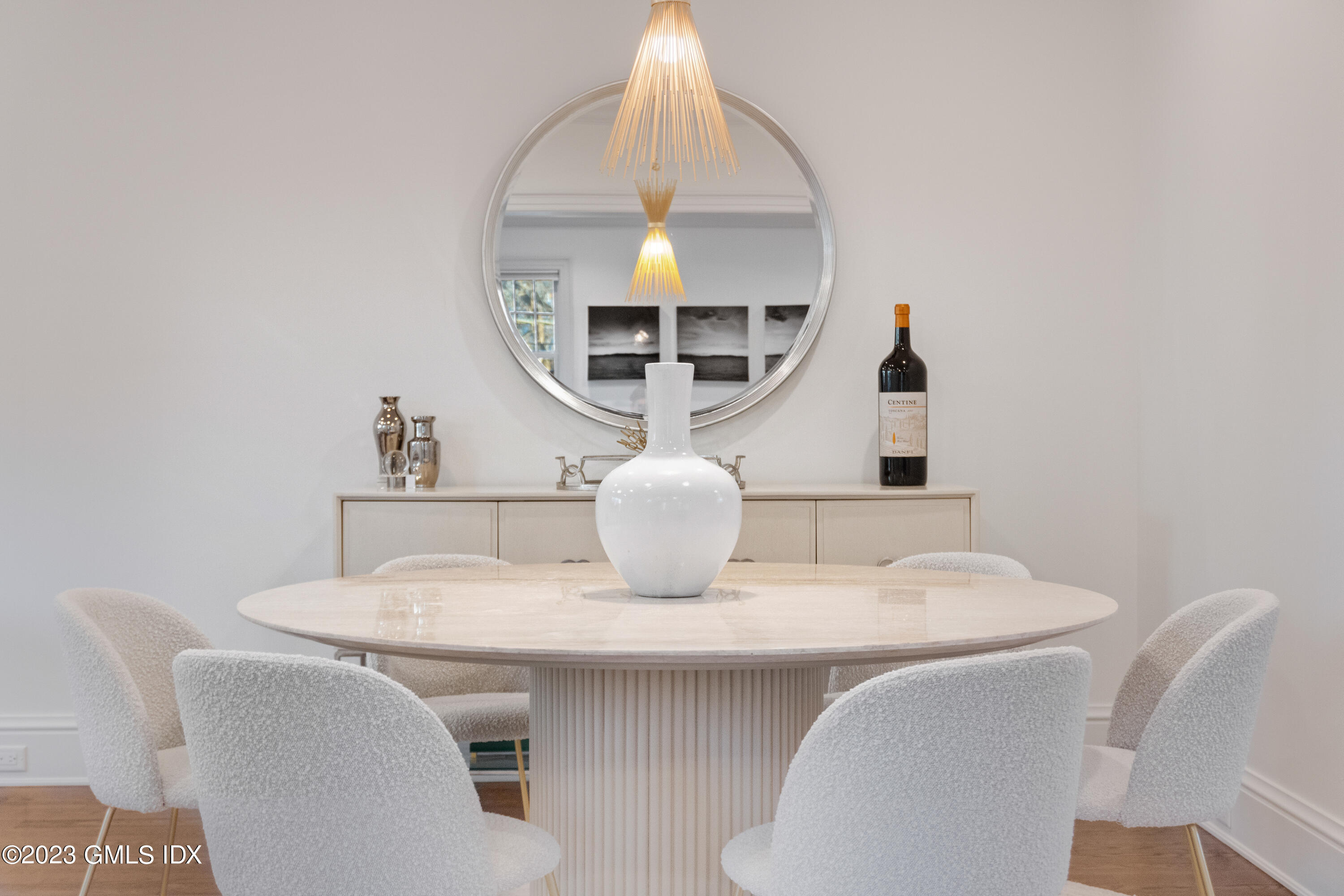 3 Orchard Place, Unit A Greenwich, CT 06830 - Photo 12 of 24 a view of a dining room with furniture and a mirror