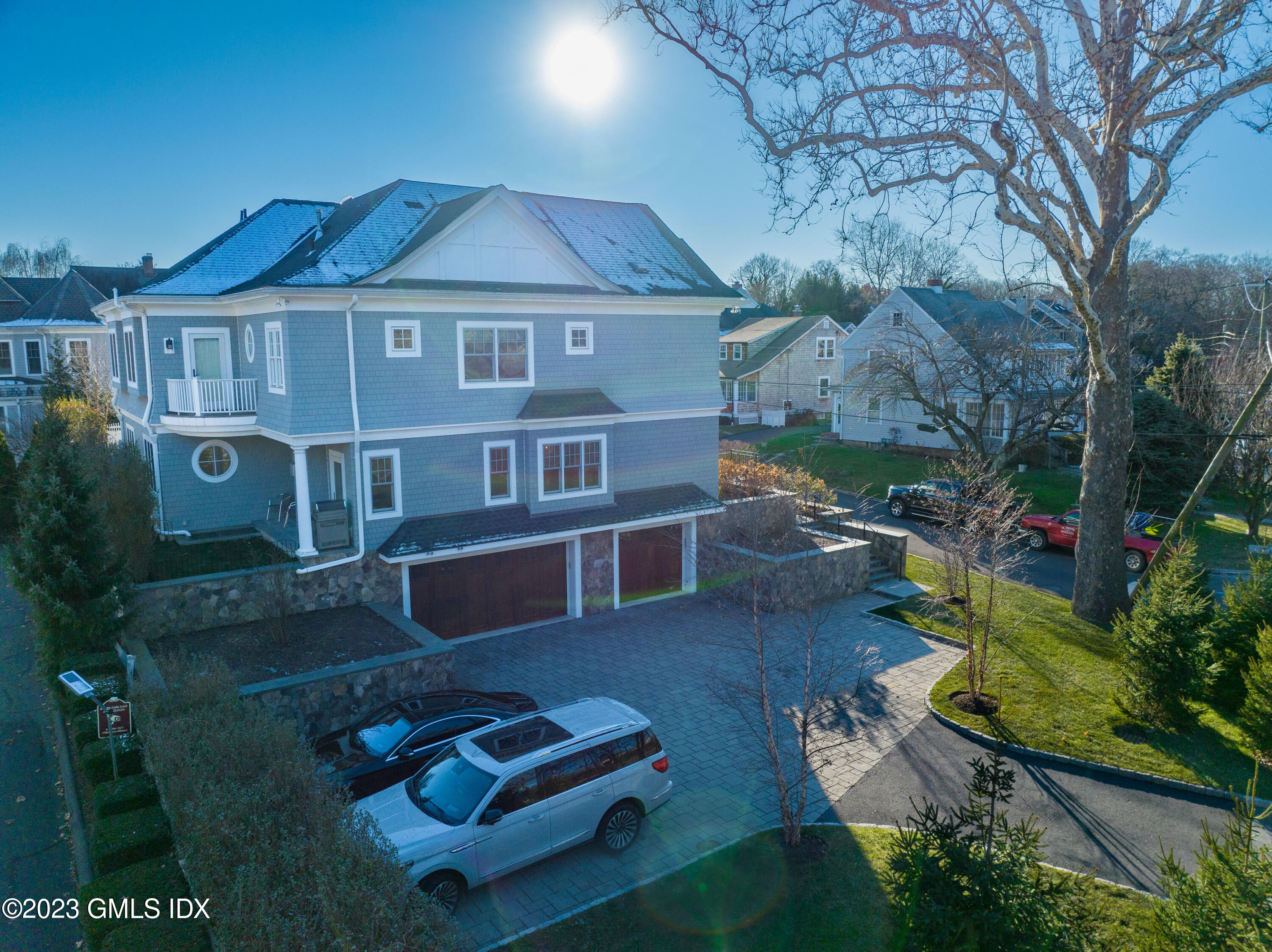 3 Orchard Place, Unit A Greenwich, CT 06830 - Photo 19 of 24 a front view of a house with garden
