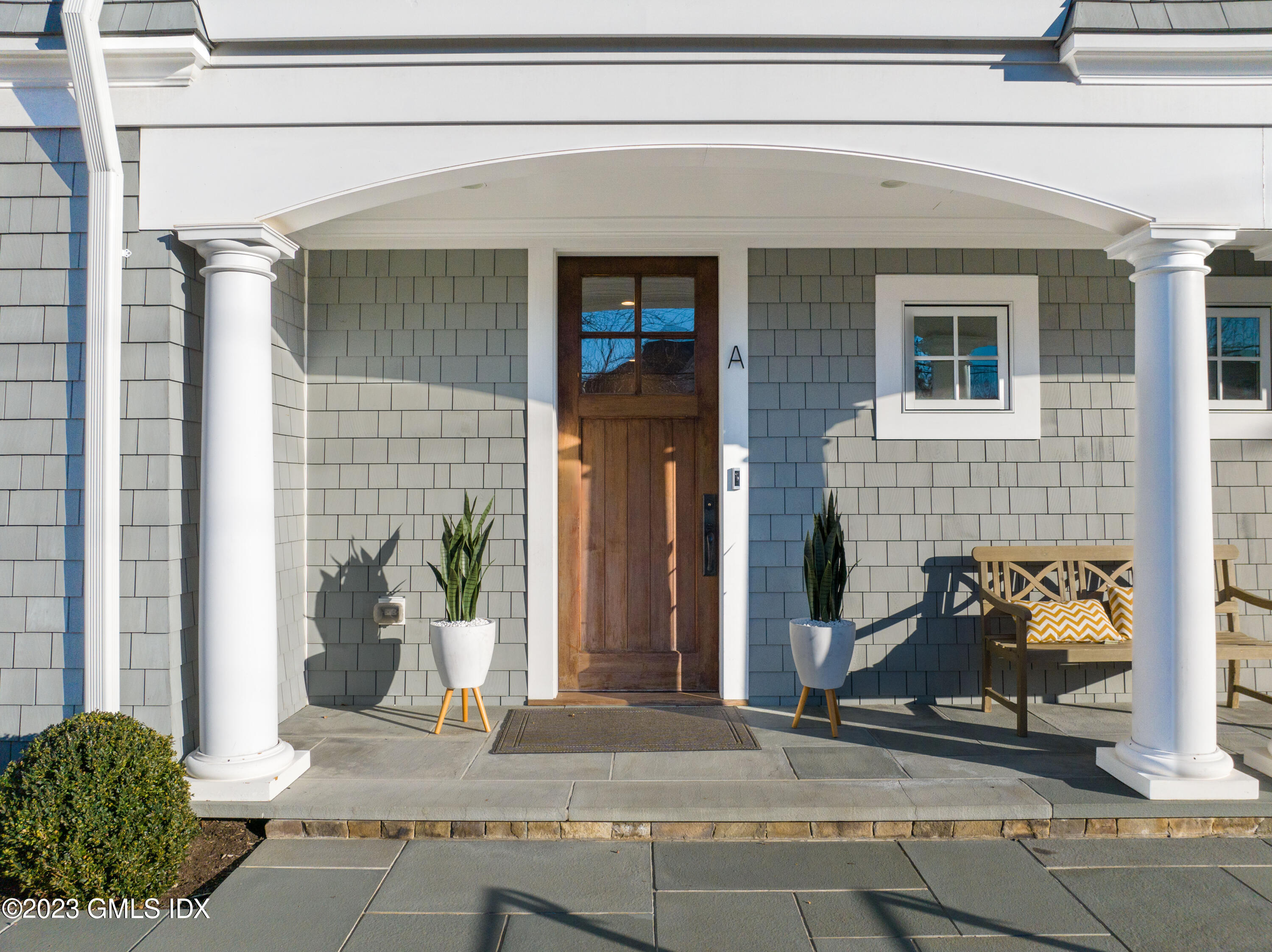 3 Orchard Place, Unit A Greenwich, CT 06830 - Photo 2 of 24 a front view of a house with a garage