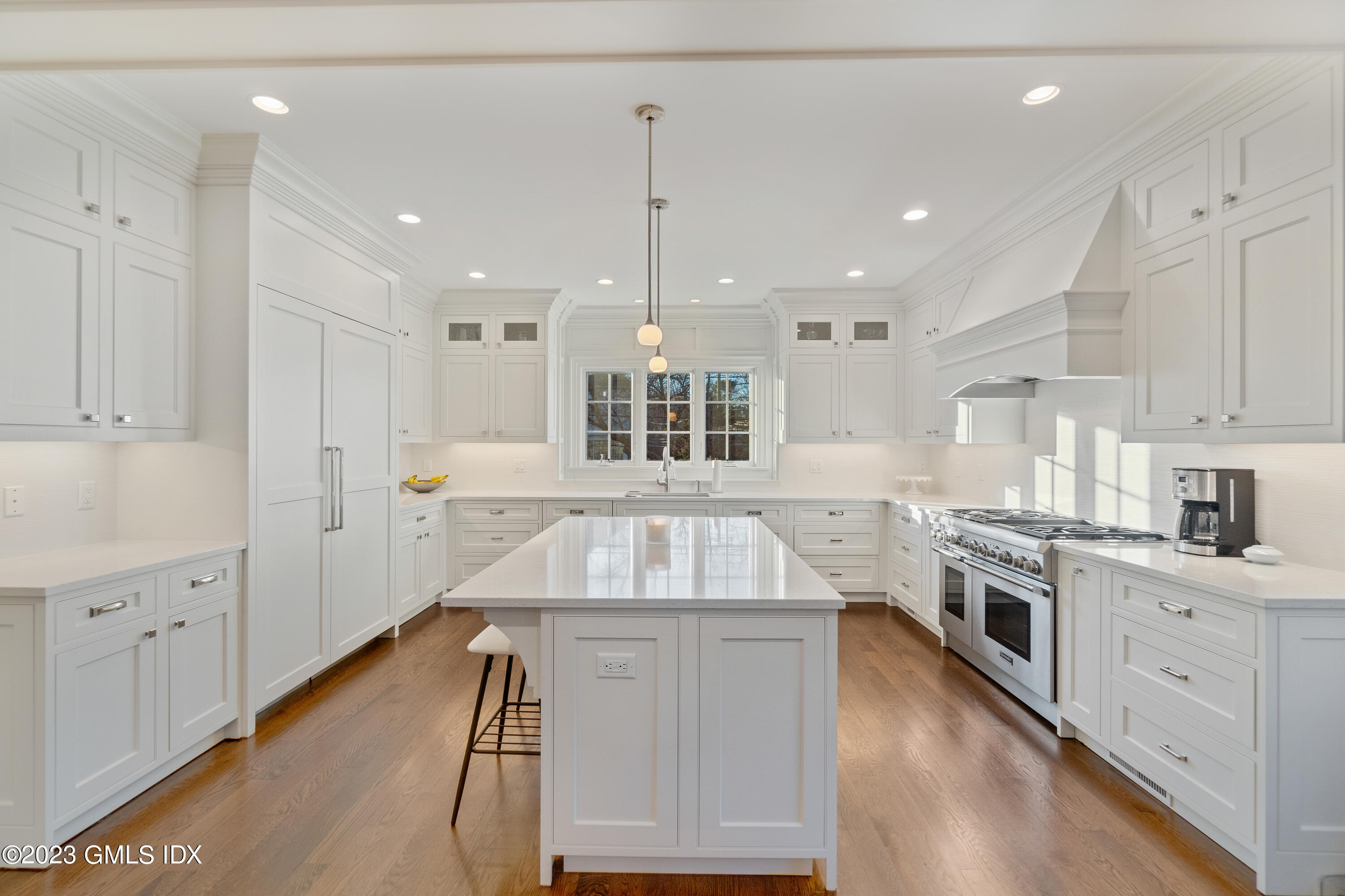 3 Orchard Place, Unit A Greenwich, CT 06830 - Photo 5 of 24 an open kitchen with white cabinets sink and stainless steel appliances