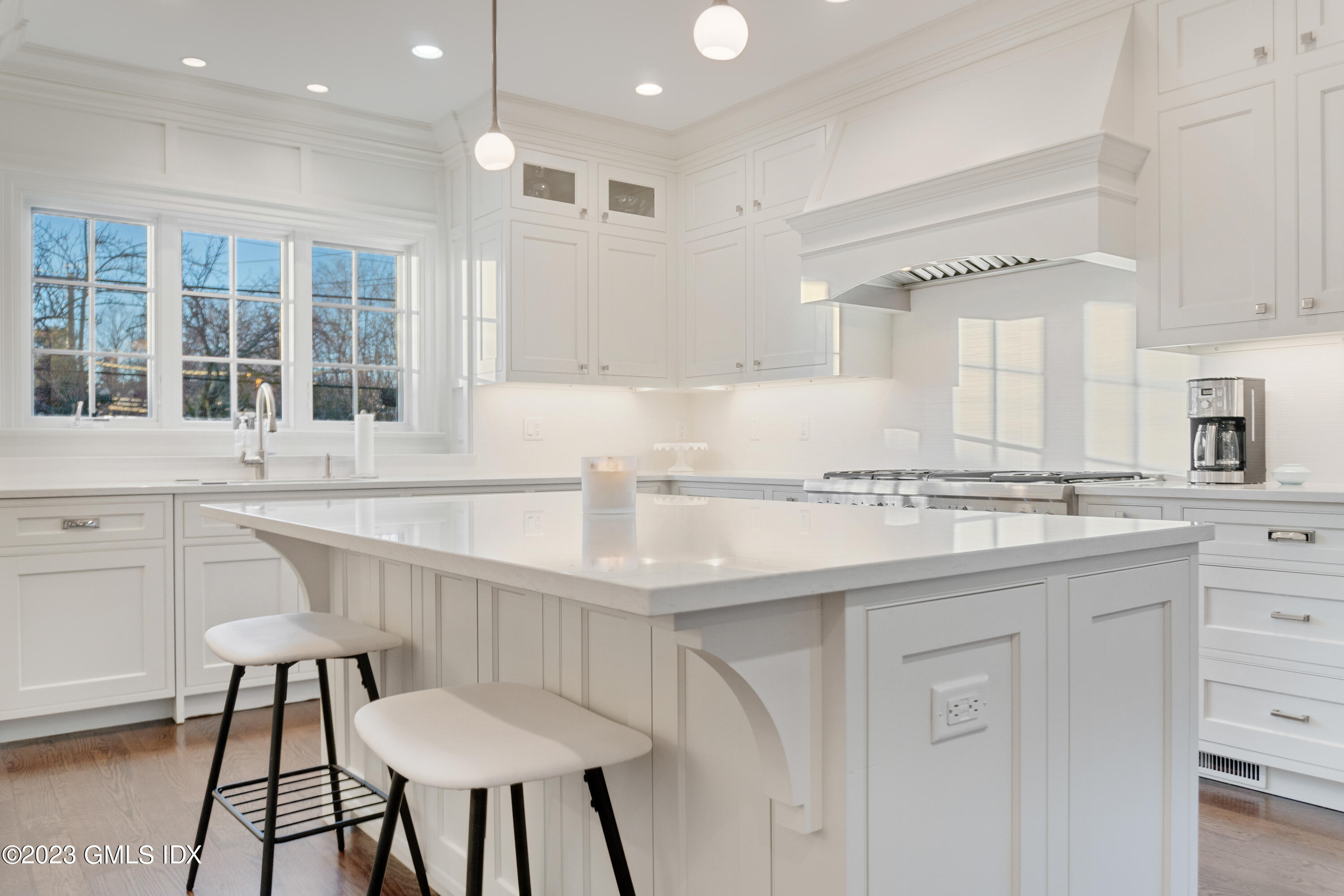 3 Orchard Place, Unit A Greenwich, CT 06830 - Photo 8 of 24 a kitchen with a sink and chairs