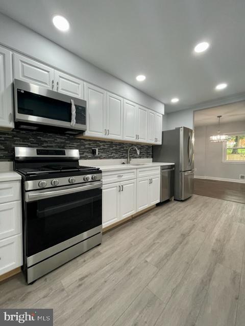 a kitchen with stainless steel appliances and a stove top oven