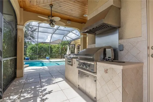 a kitchen with a stove a sink and a table