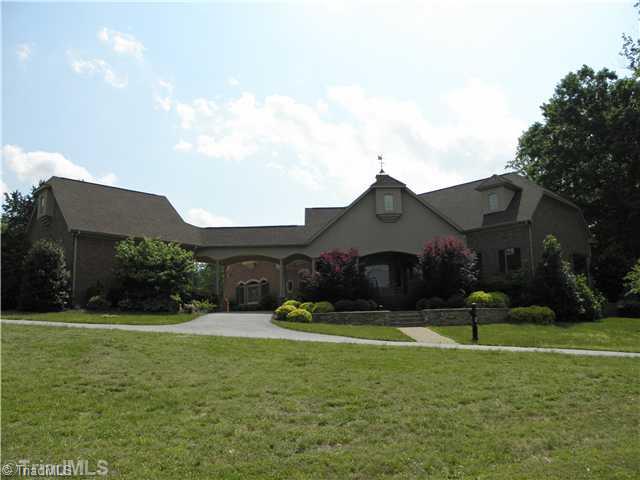 8640 Adkins Road Colfax, NC 27235 - Photo 1 of 16 Exterior Front.