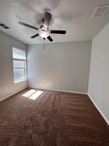 a view of empty room with windows