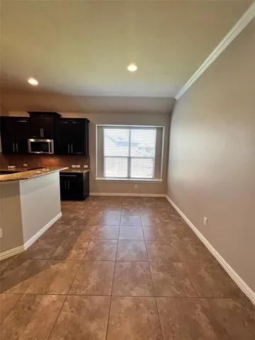 a view of a kitchen with a sink and a microwave