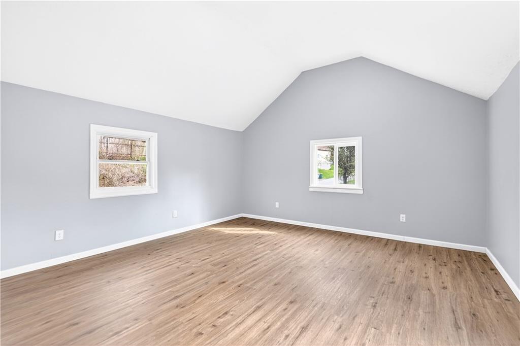 93 Old 51 Road Perryopolis, PA 15473 - Photo 23 of 44 an empty room with wooden floor and windows