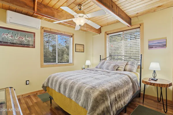 a bedroom with a bed and window