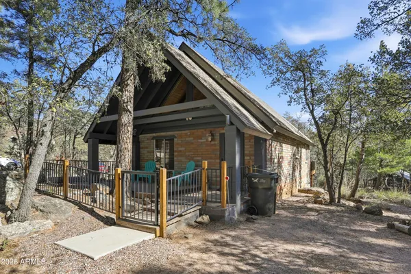 a view of a house with a door and wooden walls