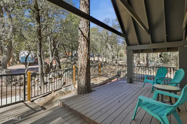 a view of balcony with furniture and wooden floor