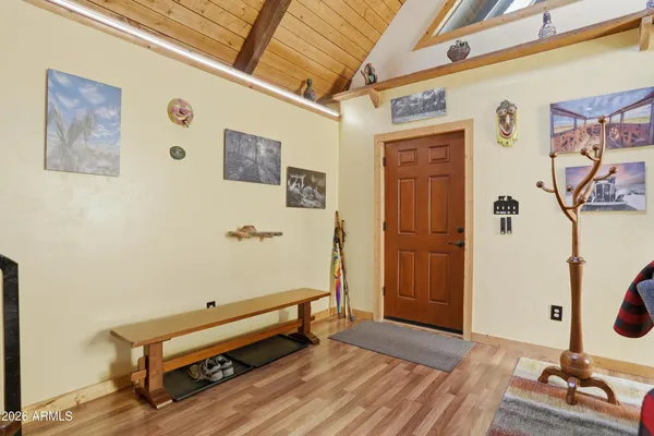 a room with wooden floor and furniture