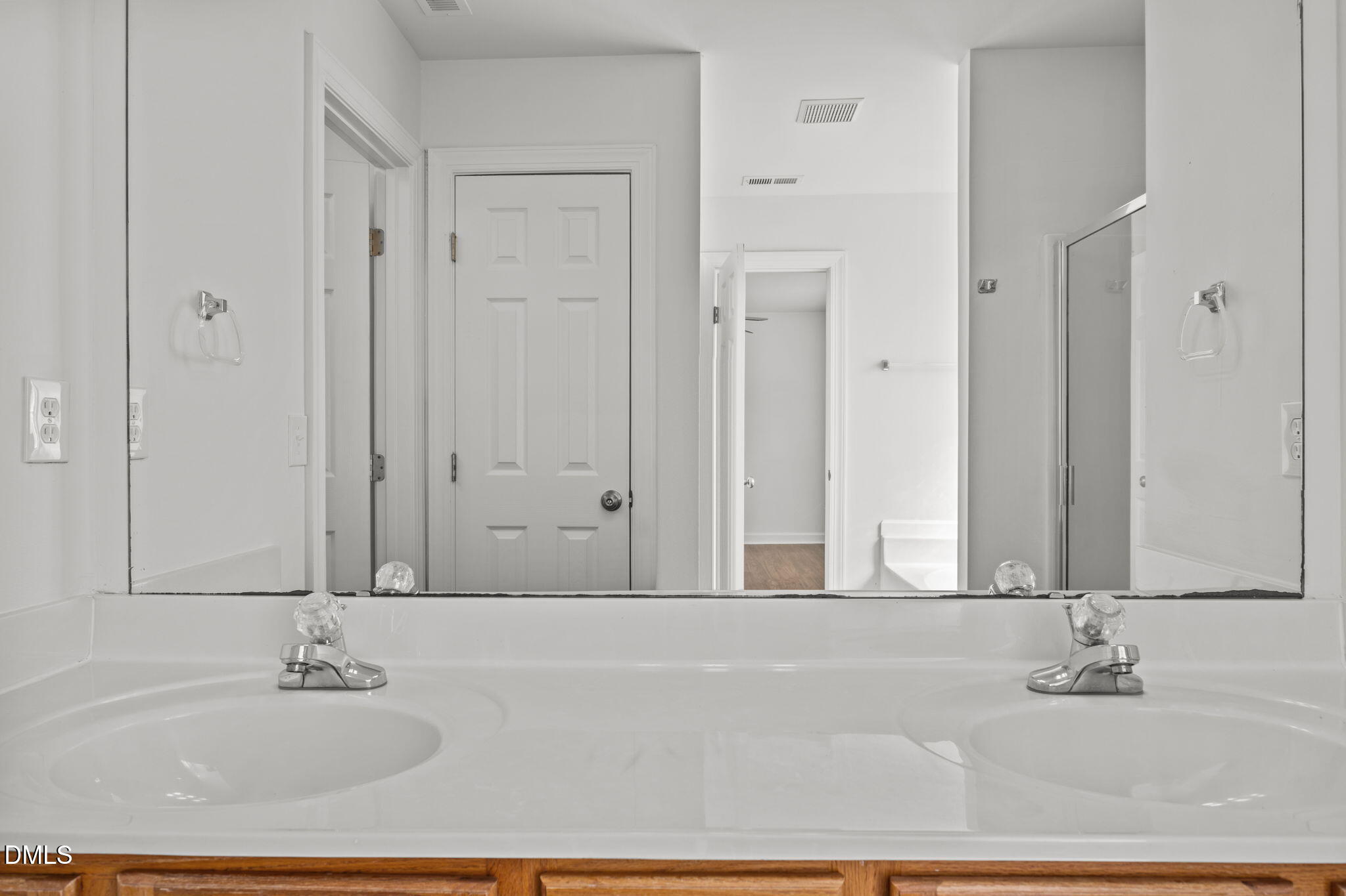 9220 Pennythorne Court Raleigh, NC 27615 - Photo 31 of 49 a bathroom with a granite countertop sink and a mirror