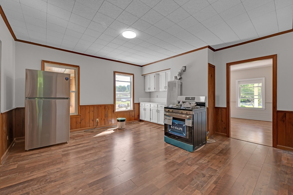 47 Morris Street Southbridge, MA 01550 - Photo 14 of 40 a view of a kitchen with a sink stove cabinets and empty room