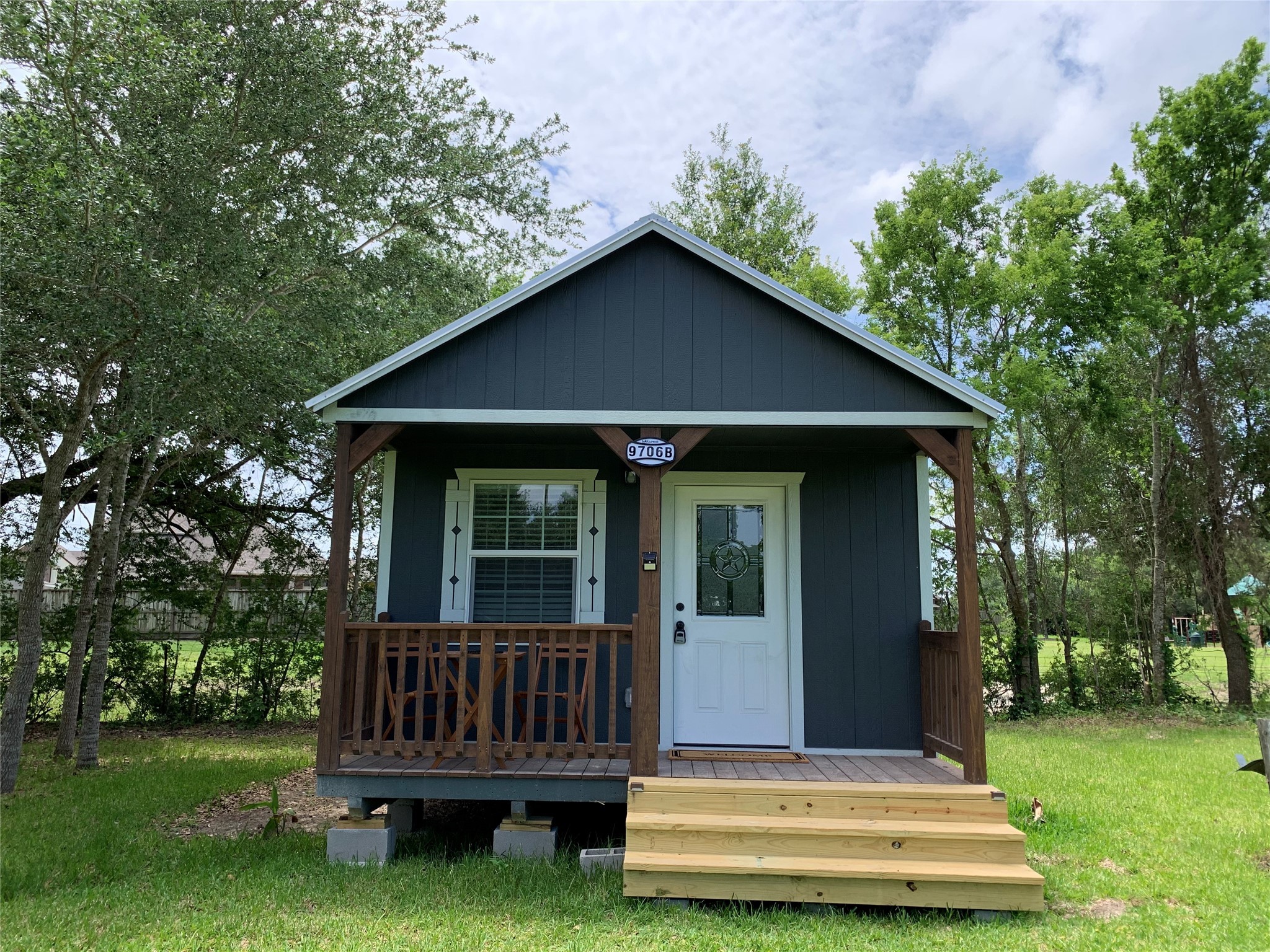 9706 Camelots Court, Unit B Pearland, TX 77584 - Photo 1 of 8 a view of a house with a yard deck and a garden