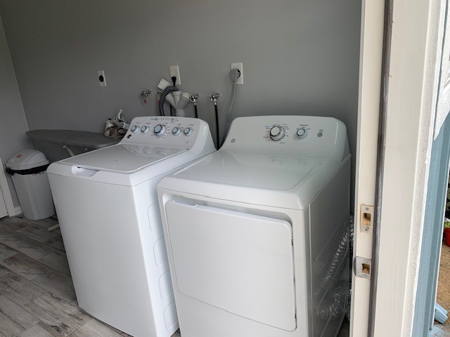 9706 Camelots Court, Unit B Pearland, TX 77584 - Photo 6 of 8 a utility room with dryer and washer