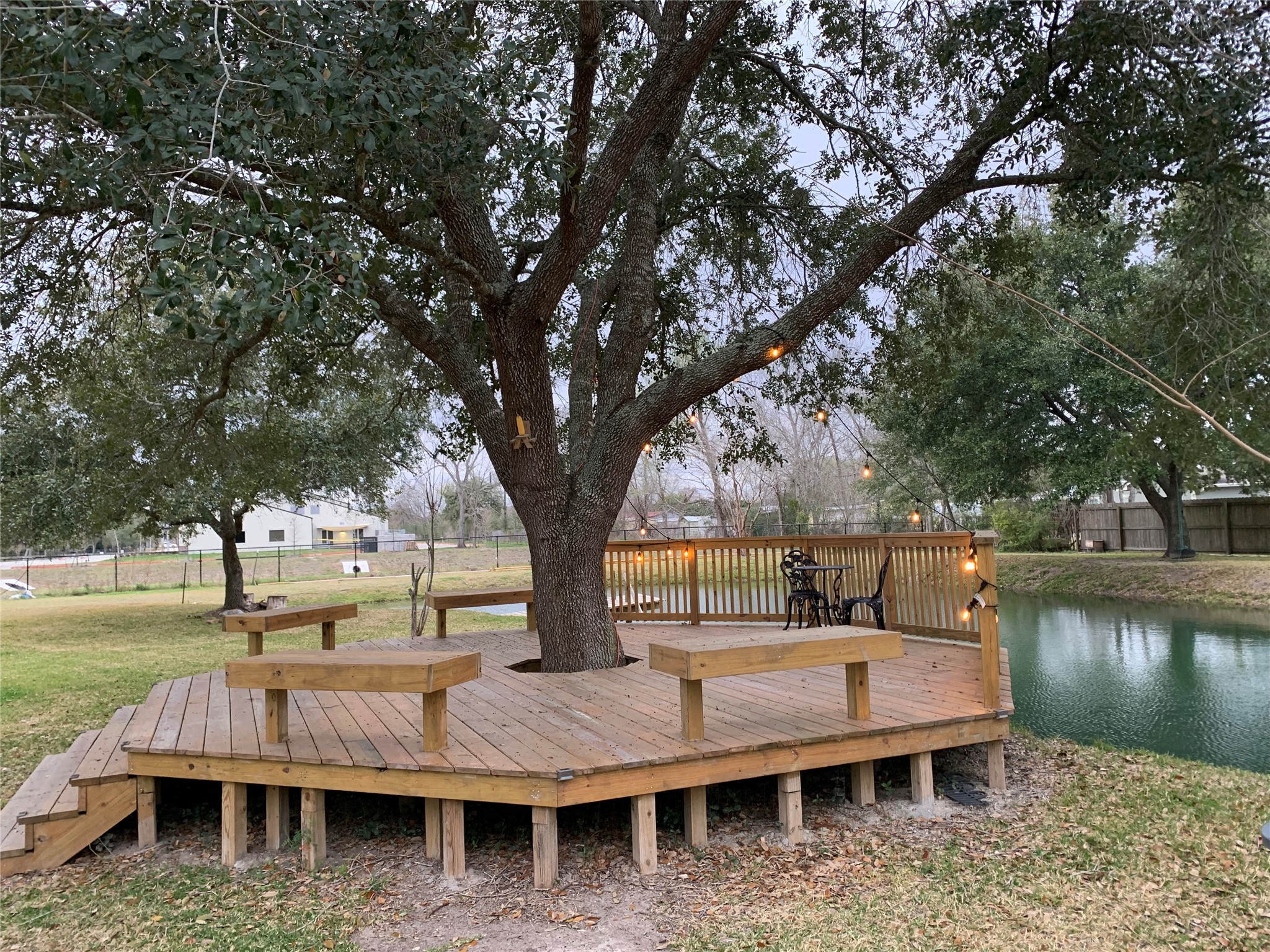 9706 Camelots Court, Unit B Pearland, TX 77584 - Photo 7 of 8 a view of swimming pool with outdoor seating and lake