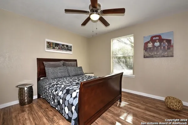 a bed sitting in a bedroom next to a window
