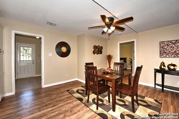 a view of a dining room with furniture and wooden floor