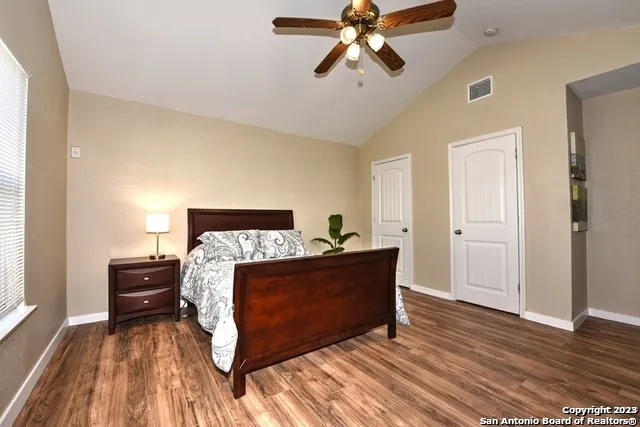 a bed room with a bed and a chandelier
