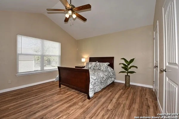 a living room with furniture lamp and a window