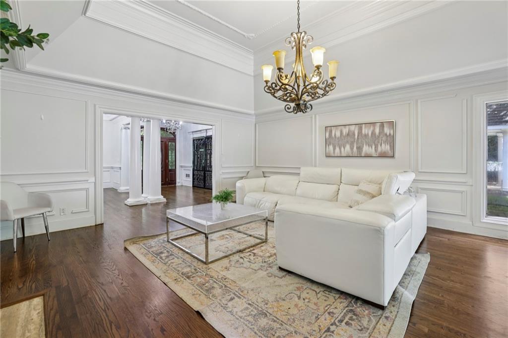 13039 Freemanville Road Alpharetta, GA 30004 - Photo 12 of 62 a living room with furniture and a chandelier