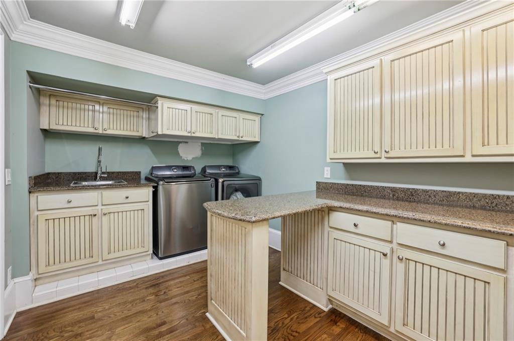 13039 Freemanville Road Alpharetta, GA 30004 - Photo 17 of 62 a kitchen with stainless steel appliances granite countertop a stove a sink and a microwave