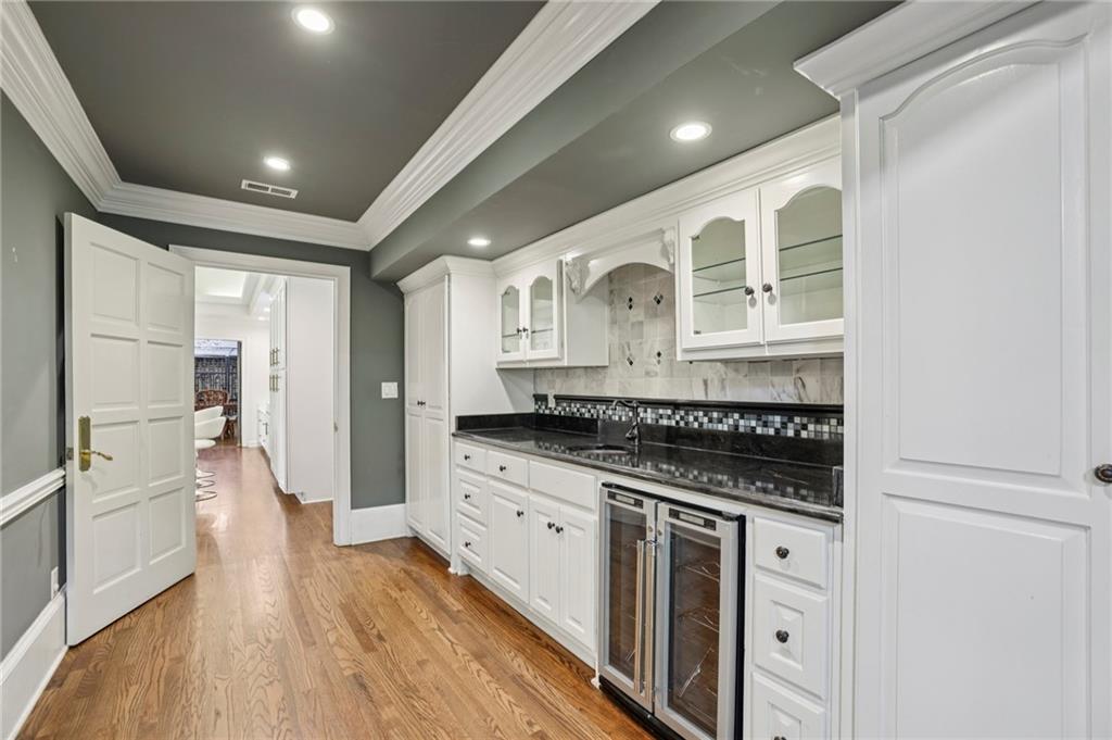 13039 Freemanville Road Alpharetta, GA 30004 - Photo 18 of 62 a kitchen with granite countertop a stove a sink and a refrigerator