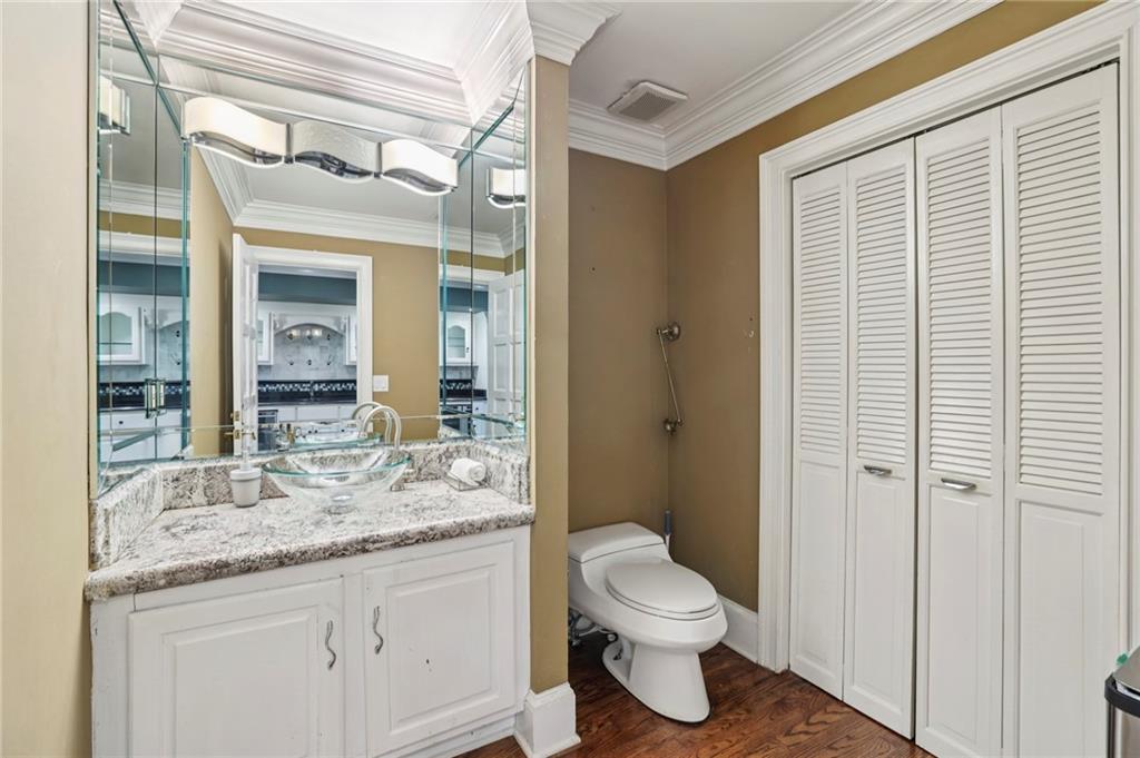 13039 Freemanville Road Alpharetta, GA 30004 - Photo 19 of 62 a bathroom with a granite countertop sink toilet and shower