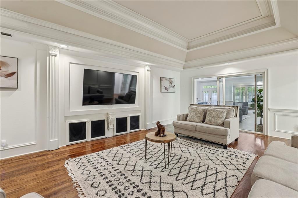 13039 Freemanville Road Alpharetta, GA 30004 - Photo 21 of 62 a living room with furniture and a flat screen tv