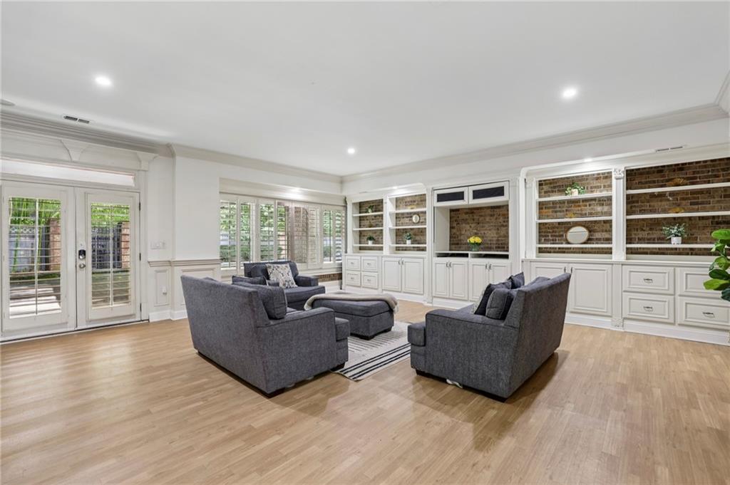 13039 Freemanville Road Alpharetta, GA 30004 - Photo 22 of 62 a living room with furniture and a flat screen tv