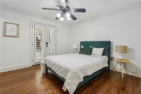 a spacious bedroom with two bed and a large window