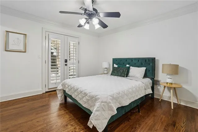 a spacious bedroom with two bed and a large window