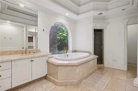 a spacious bedroom with a bed and window