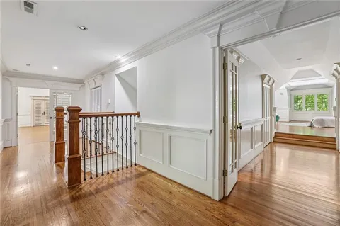 a bathroom with a sink a mirror and a vanity