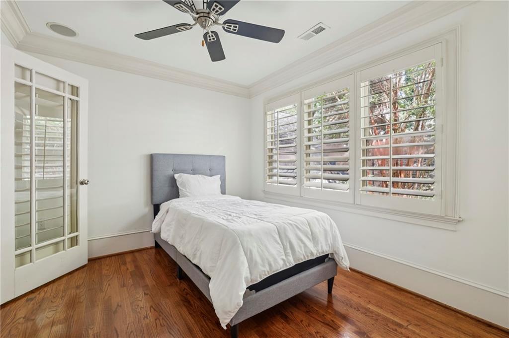 13039 Freemanville Road Alpharetta, GA 30004 - Photo 43 of 62 a large bed sitting in a bedroom next to a window