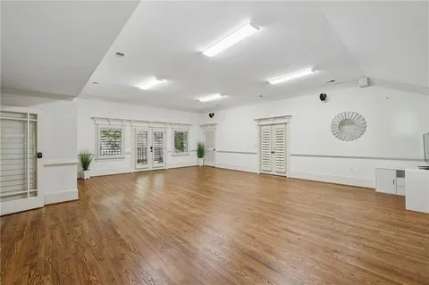 a kitchen with stainless steel appliances kitchen island granite countertop a table and chairs in it