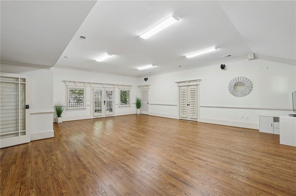 13039 Freemanville Road Alpharetta, GA 30004 - Photo 45 of 62 an empty room with wooden floor and windows