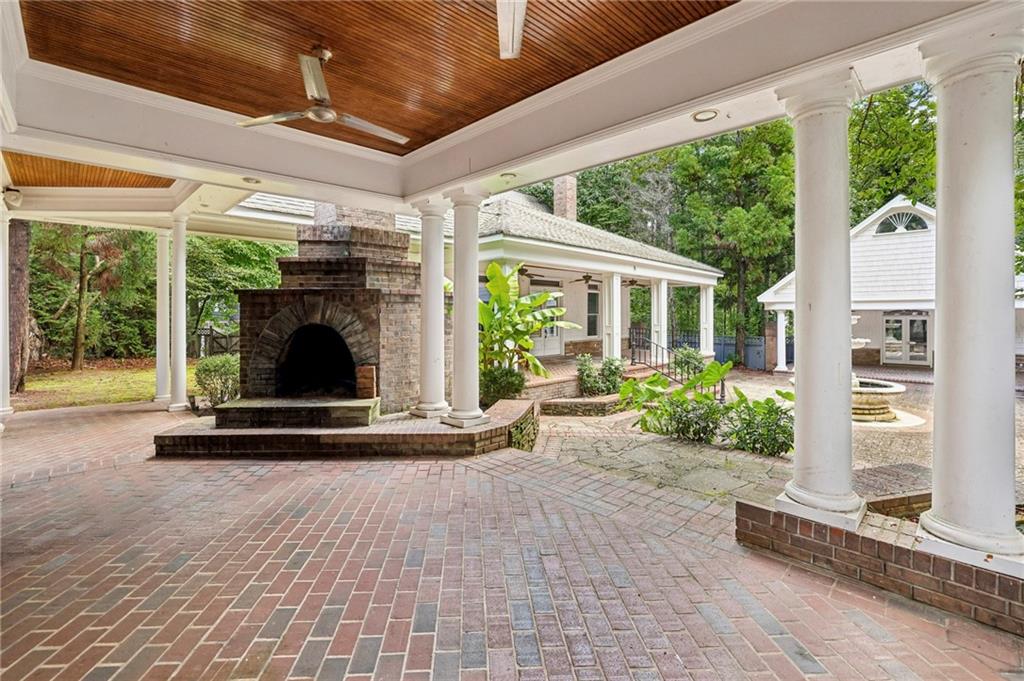 13039 Freemanville Road Alpharetta, GA 30004 - Photo 49 of 62 a view of a porch with furniture and floor to ceiling window