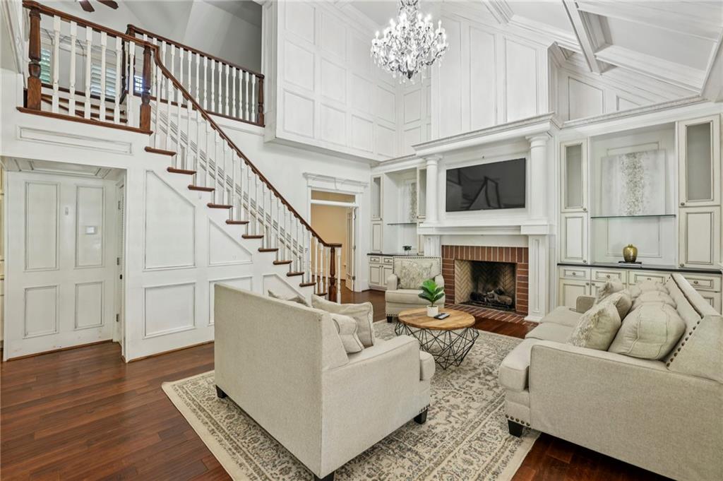 13039 Freemanville Road Alpharetta, GA 30004 - Photo 51 of 62 a living room with furniture a fireplace and a ceiling fan
