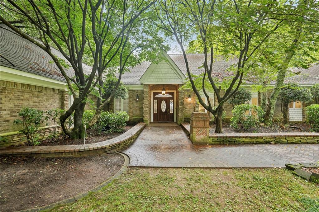 13039 Freemanville Road Alpharetta, GA 30004 - Photo 59 of 62 a view of a yard in front of a house with large tree