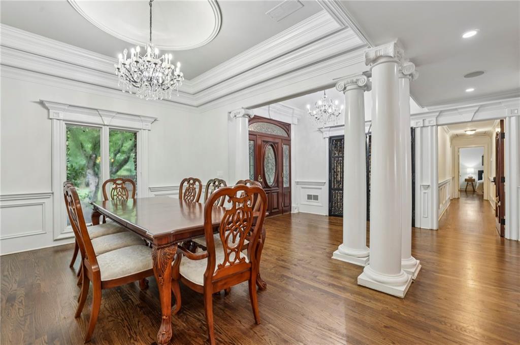 13039 Freemanville Road Alpharetta, GA 30004 - Photo 8 of 62 a view of a dining room with furniture wooden floor and chandelier
