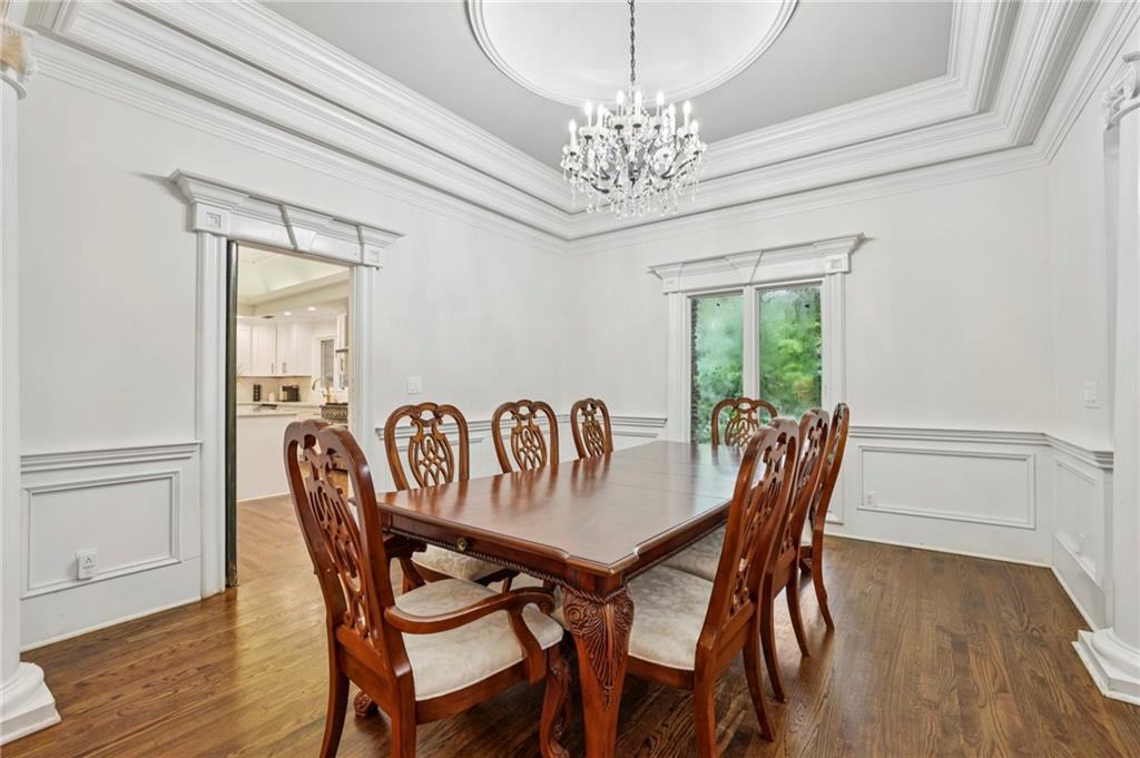 13039 Freemanville Road Alpharetta, GA 30004 - Photo 9 of 62 a view of a dining room with furniture window and wooden floor
