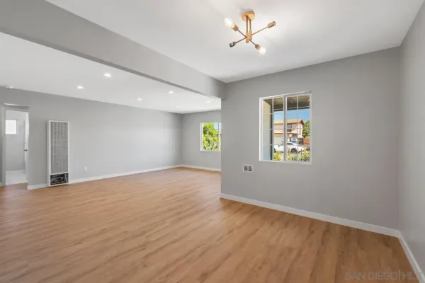 a kitchen with cabinets stainless steel appliances a sink and a stove