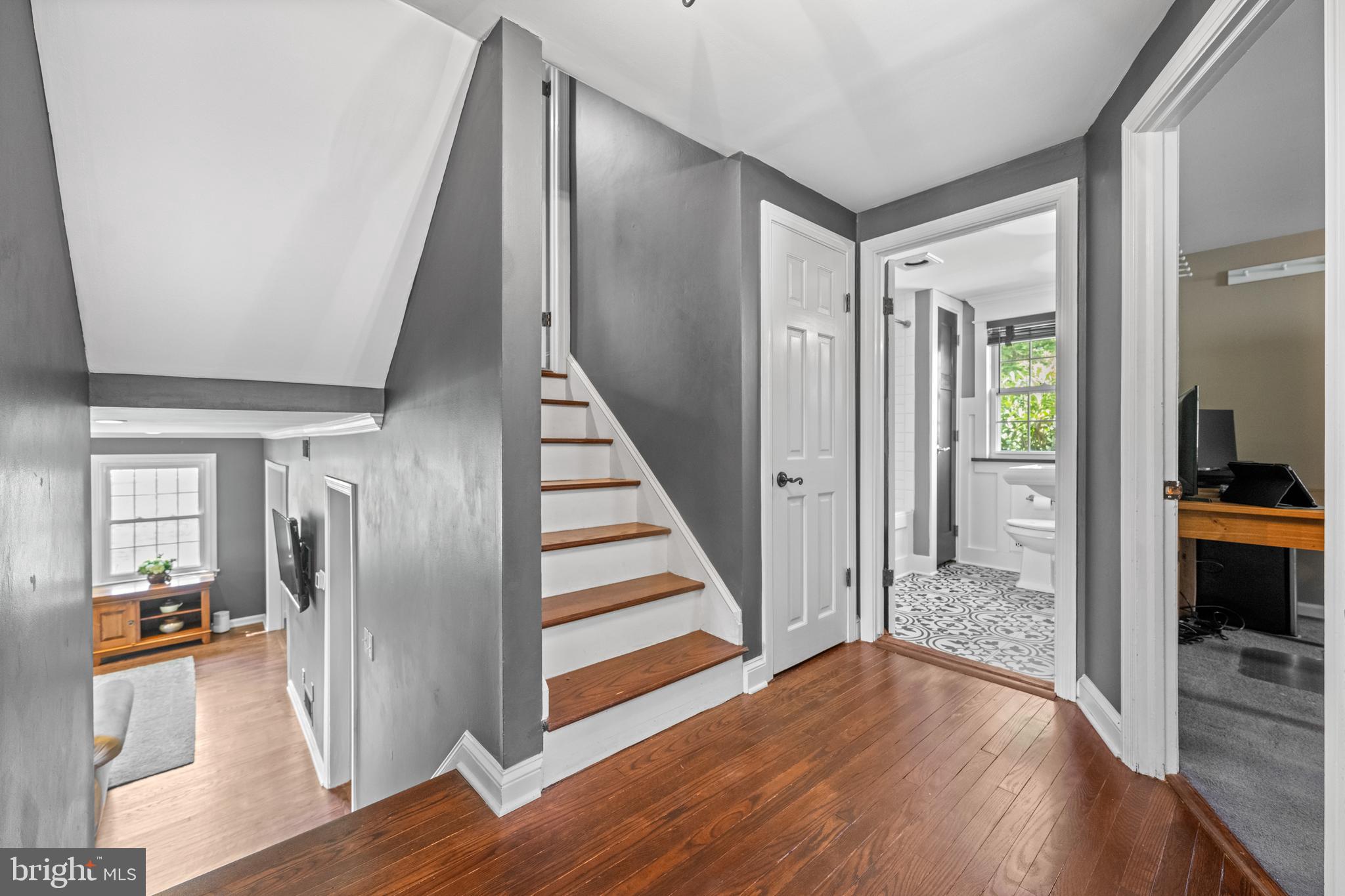 207 Anthony Wayne Drive Wayne, PA 19087 - Photo 19 of 47 a view of a hallway with wooden floor and staircase