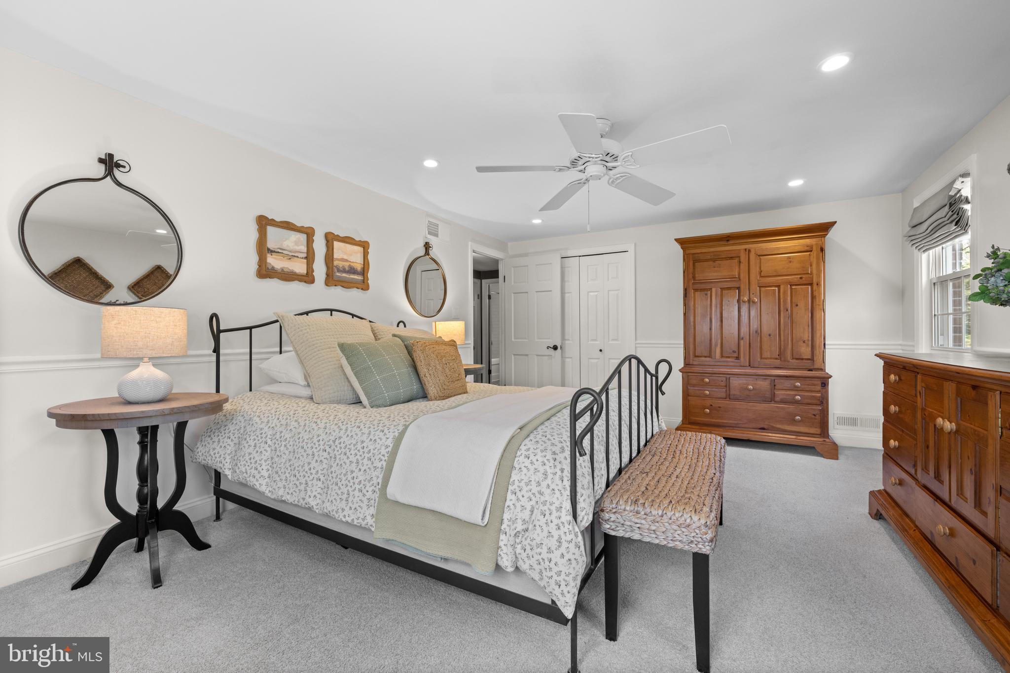 207 Anthony Wayne Drive Wayne, PA 19087 - Photo 20 of 47 a bedroom with a bed a mirror and furniture