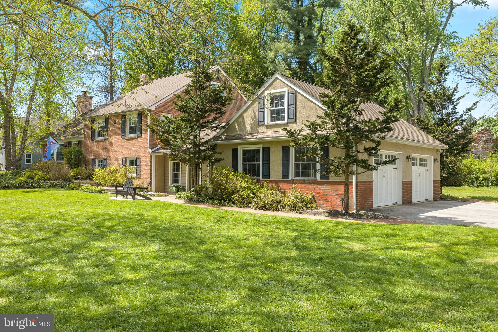 207 Anthony Wayne Drive Wayne, PA 19087 - Photo 2 of 47 a front view of a house with a yard and trees