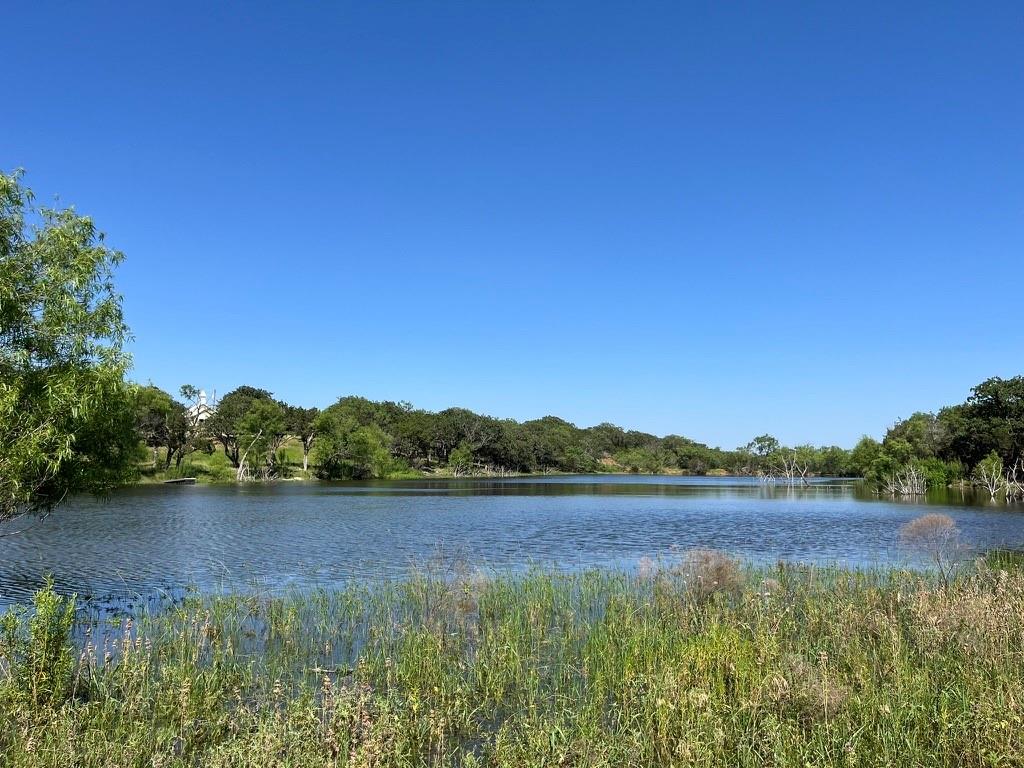494 Co Road Strawn, TX 76475 - Photo 11 of 13 a view of lake with mountain in background