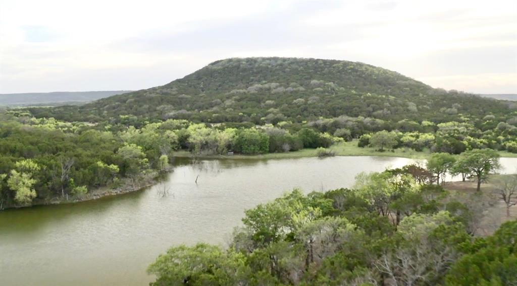 494 Co Road Strawn, TX 76475 - Photo 5 of 13 an aerial view of residential houses with outdoor space and lake view