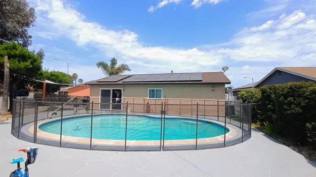 a view of a house with a small yard and plants