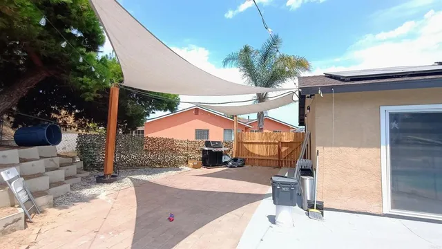 a view of a house with a patio